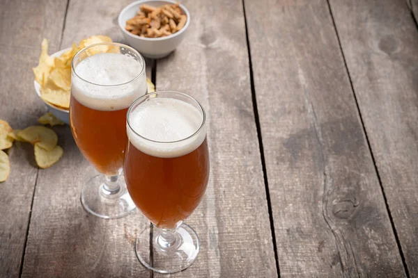 glass beer on wood background