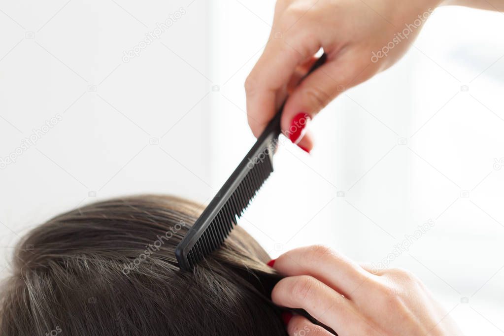 Close view of Woman doing haircut in salon