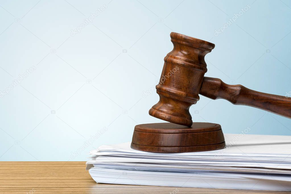 judge hammer on white paper and table