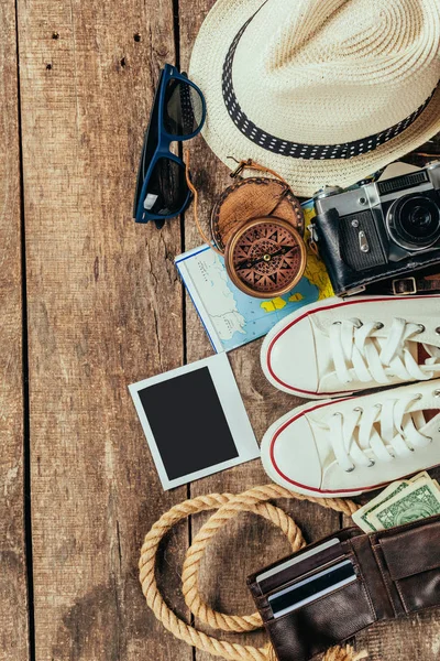 Set of trip stuff on wooden background