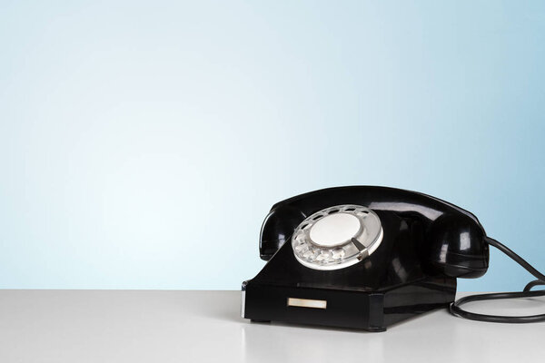 close-up view of black Retro telephone on table