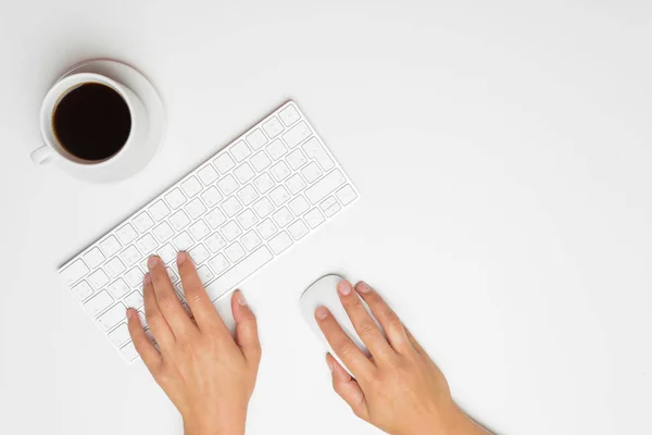 women\'s hands using keyboard and mouse