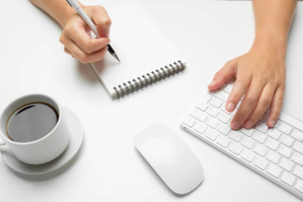 women's hands using keyboard and mouse