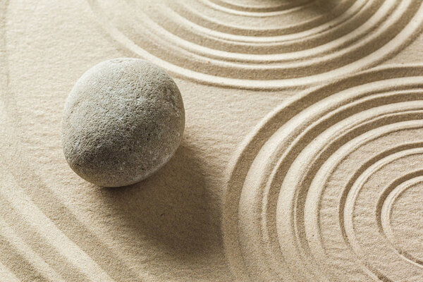 Zen stones on sand background 