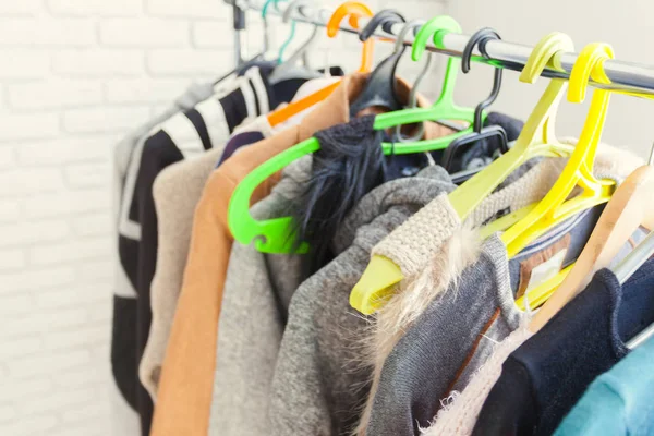 Clothing rack with hangers, close-up view