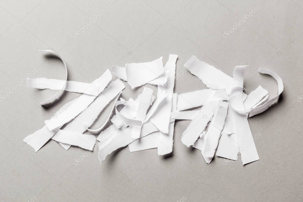 white ripped paper background, close-up view 