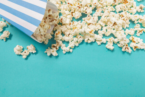 popcorn on color background close up 
