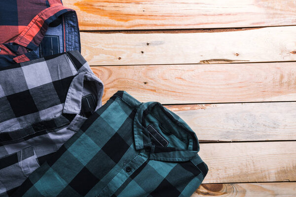shirts plaid in plan with wooden background