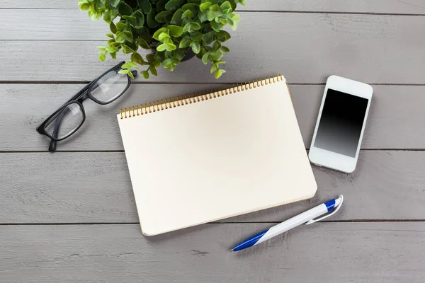 Blank note book on table, top view