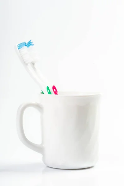 Toothbrushes Glass Table Light Background — Stock Photo, Image