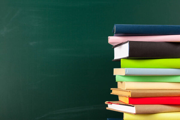 Books on Desk, Chalkboard Background