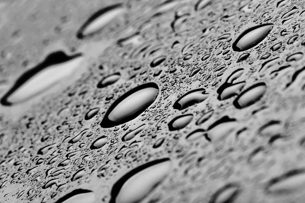 Vatten Droppar Splash Svarta Golvet Närbild — Stockfoto