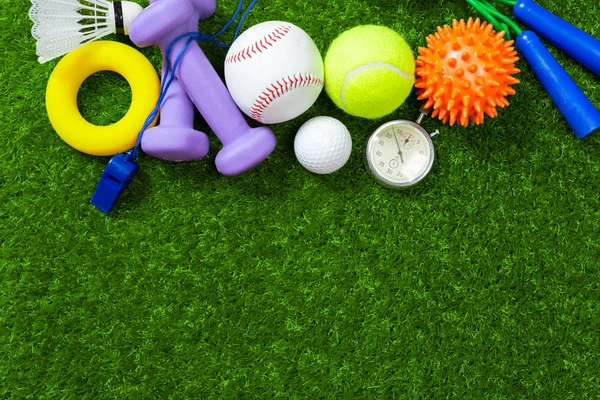 Various sport tools on grass, close-up view