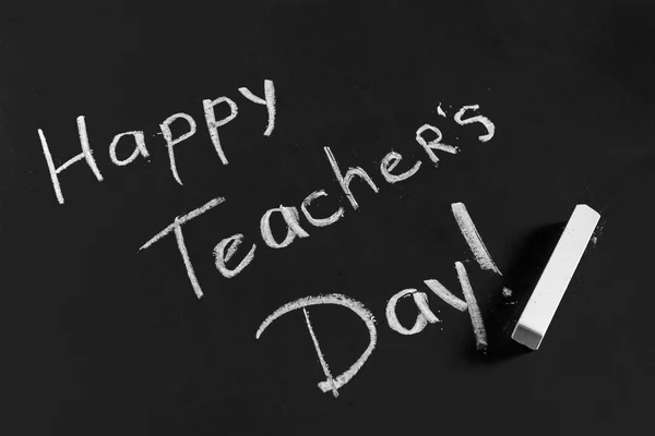 text happy teachers day written on a chalkboard, close-up view