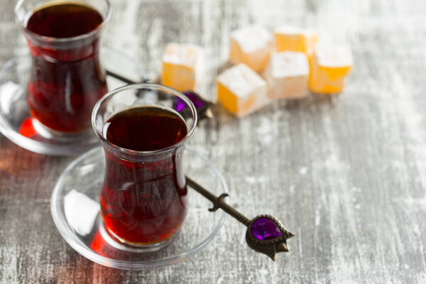 Red tea in turkish glasses on a wooden table