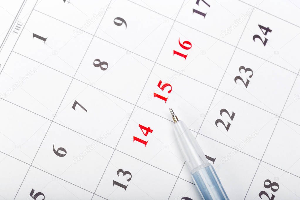 Check out the dates in a business calendar concept