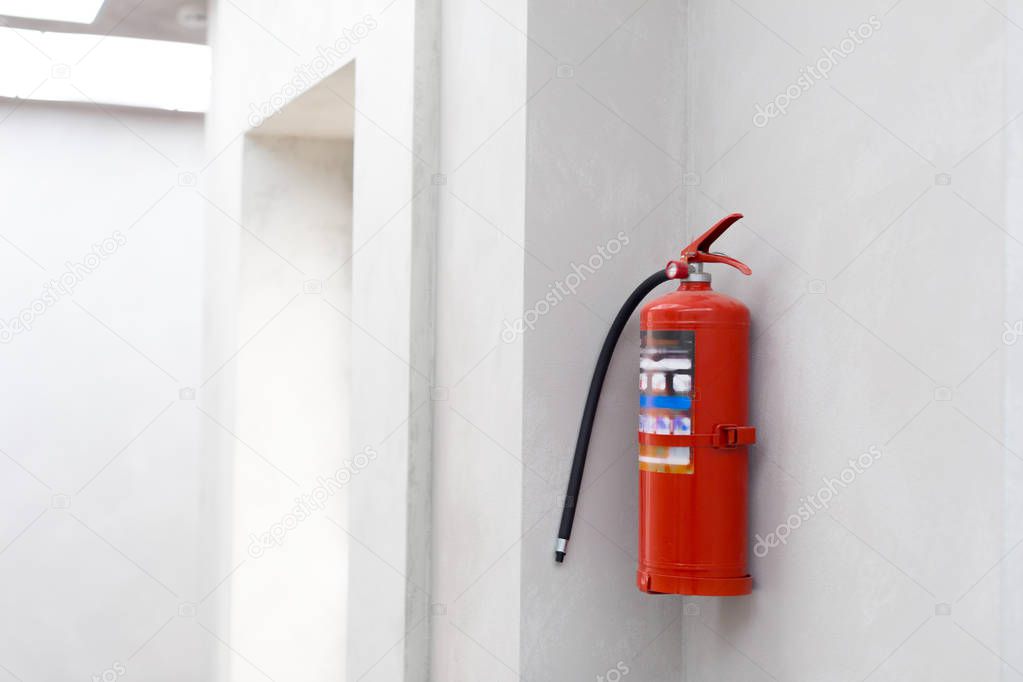 Fire extinguisher on the wall, close-up view