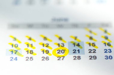 Closeup of dates on calendar page clipart