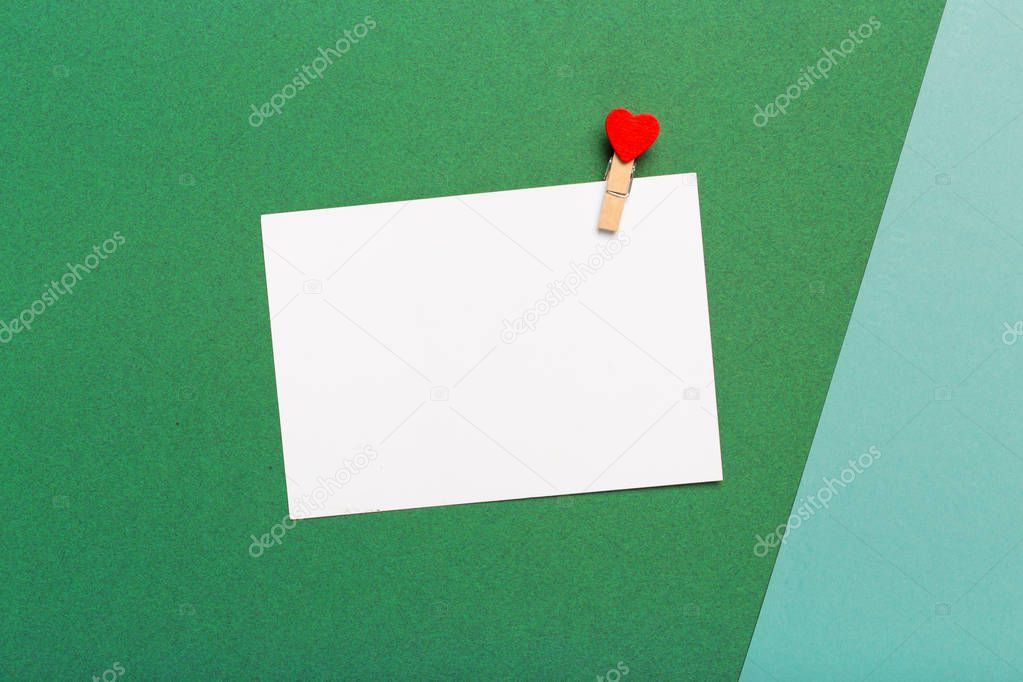 Notepad on a bright colored background, top view