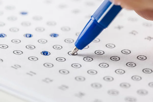 Test score sheet with answers and pencil