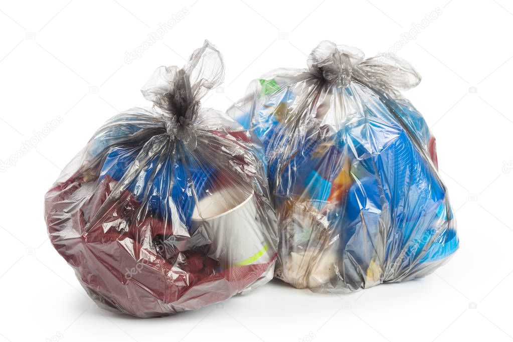 Black garbage bags isolated on white background.
