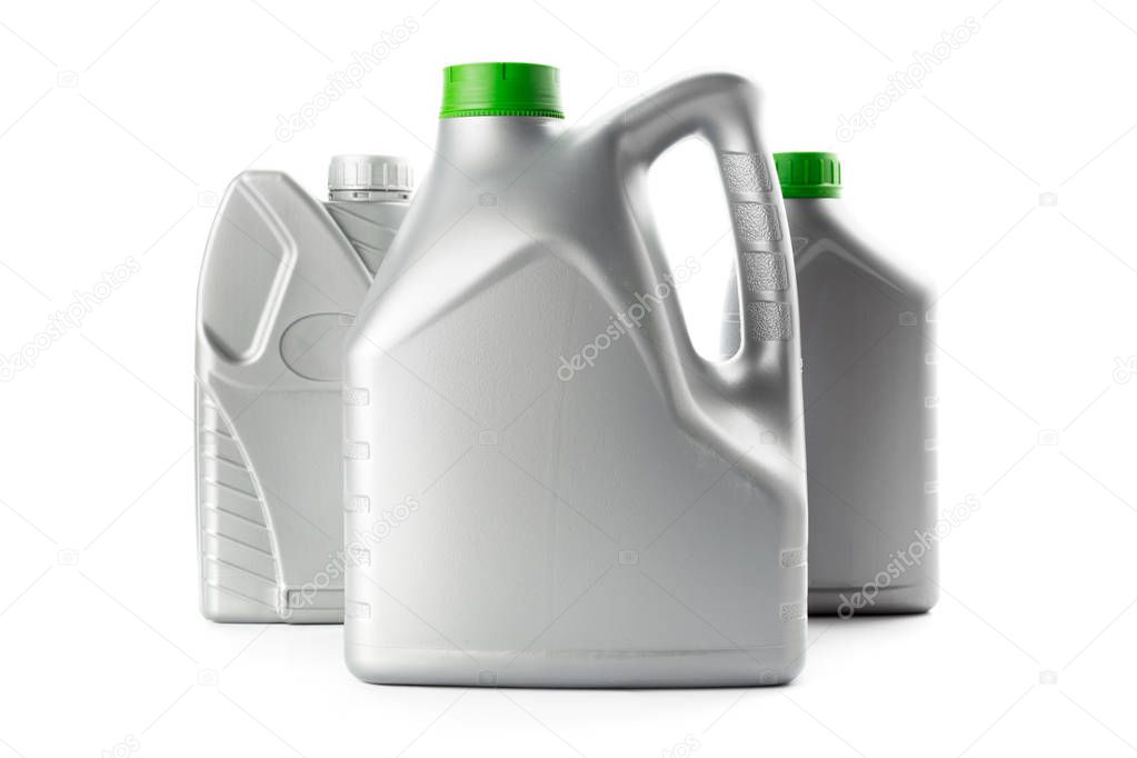 Plastic bottles from automobile oils isolated on white