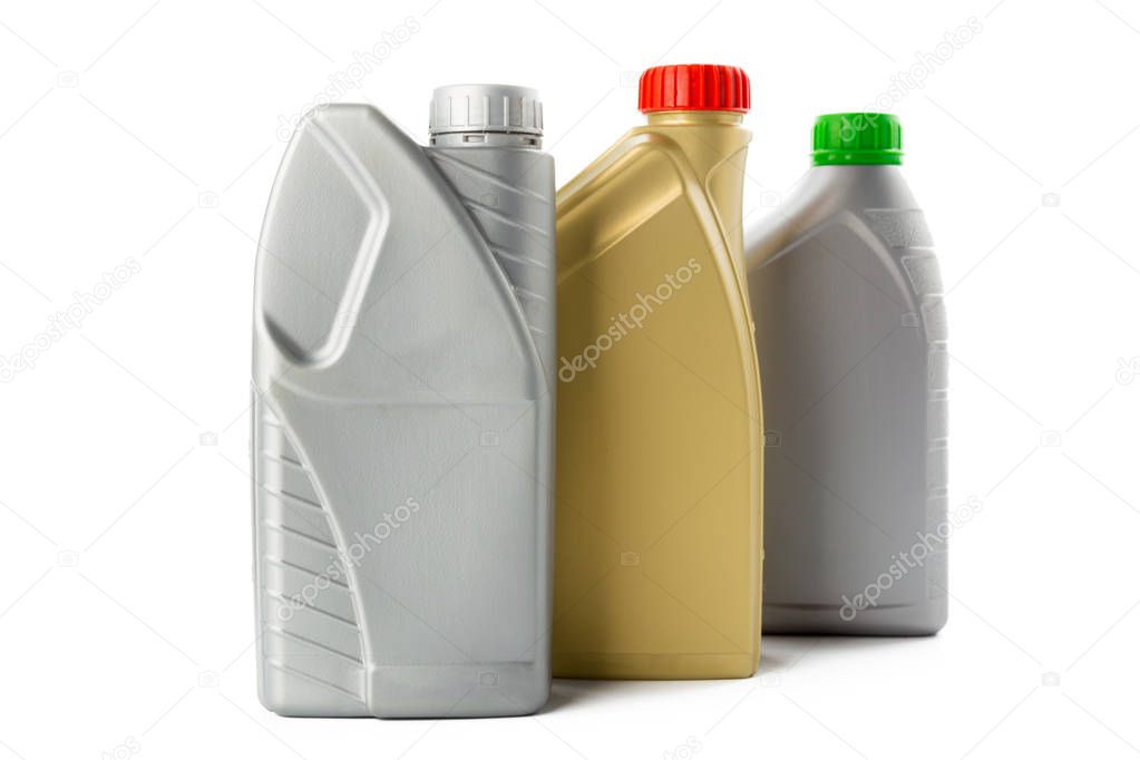 Plastic bottles from automobile oils isolated on white