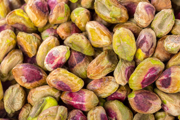 pile of roasted pistachios, close up shot