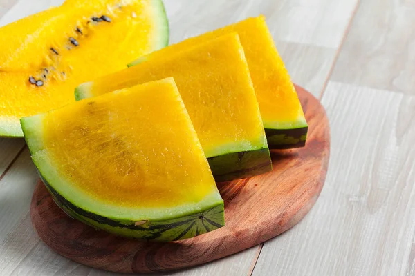 Slices of yellow watermelon on background,close up