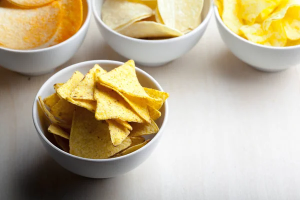 Potato chips in bowl on a table