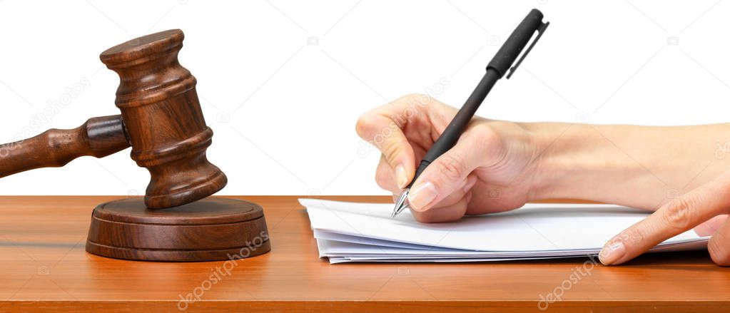 Judge Writing On Paper In Courtroom
