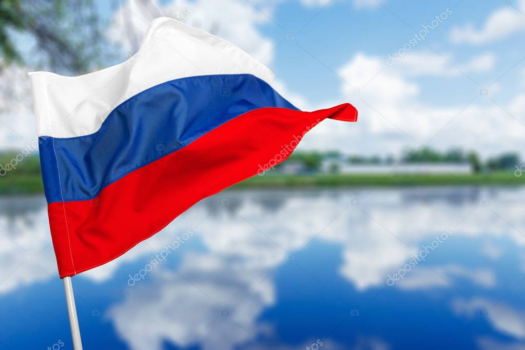 Russian flag against blue sky