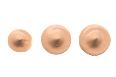 Arka plan olarak bej sıvı temel lekeleri