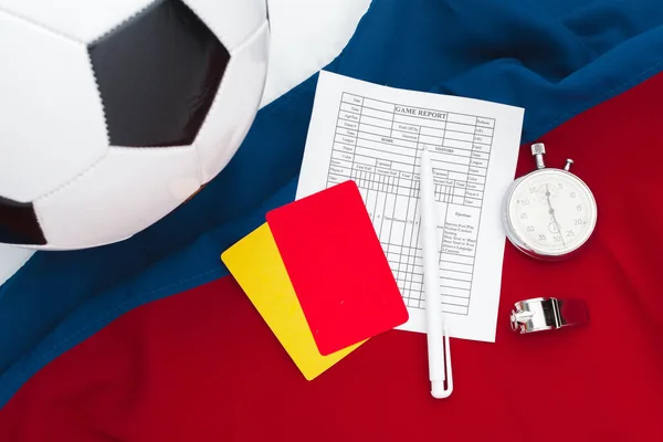 two penalty cards and a whistle for the referee