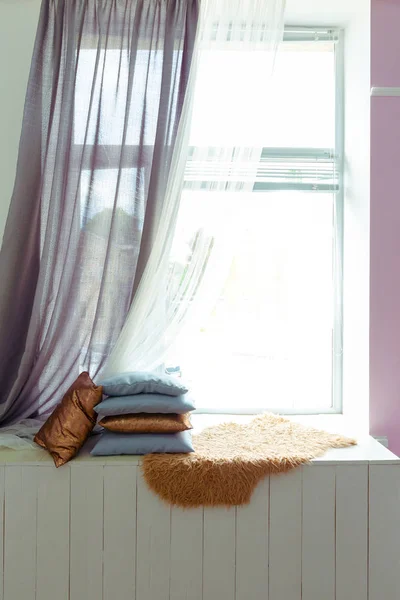 cozy window seat with cushions