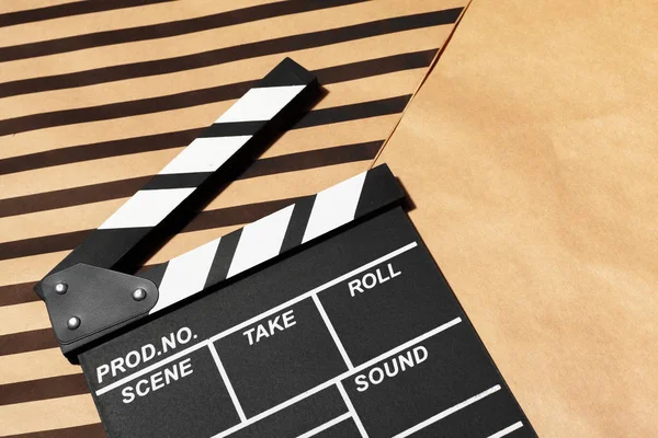 Film clapper board on a table, close-up view