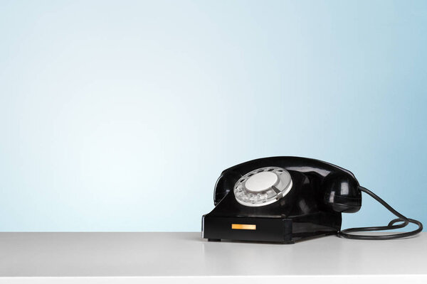Retro black telephone on table