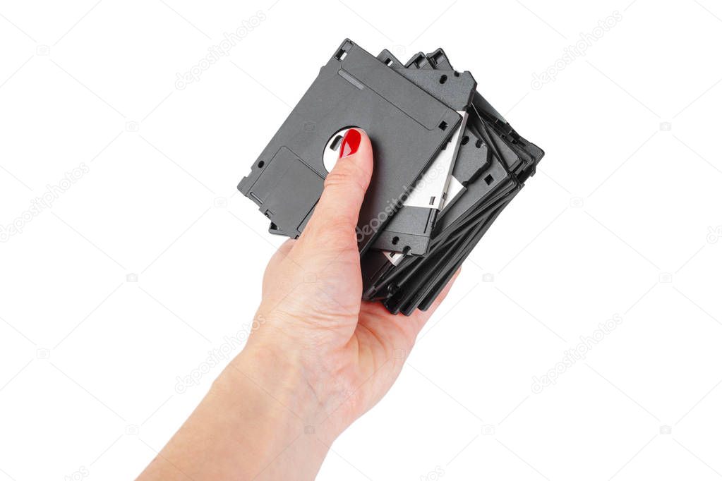 hand golding floppy disks isolated on white background