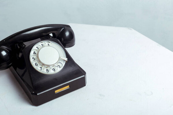 high angle view of black Retro telephone on table