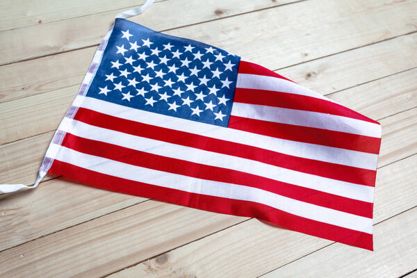 Bright American flag on wooden planks background