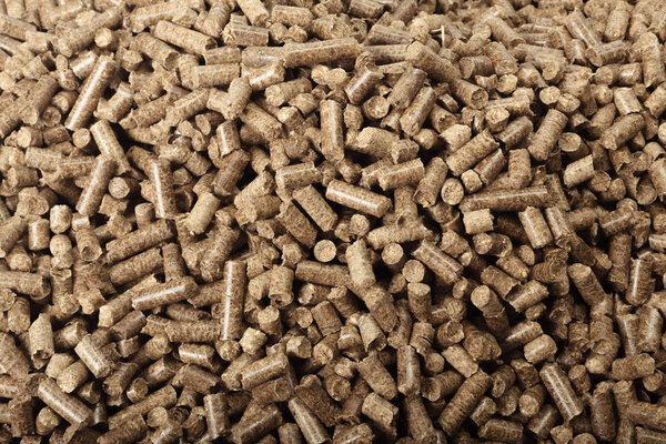 Textured background of wooden pellets.