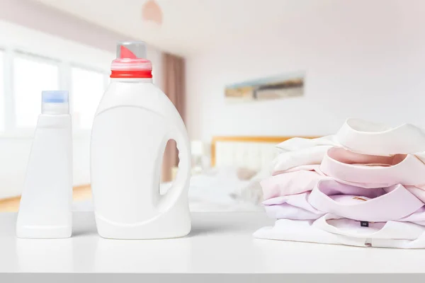 Colorful towels and liquid laundry detergent
