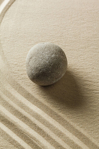 Japanese garden zen stone on sand
