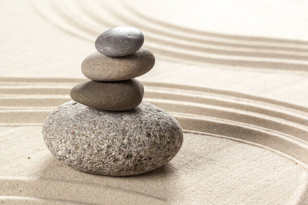 Japanese garden zen stones on sand