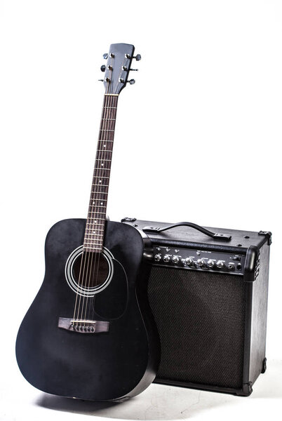 Close up of Black acoustic guitar on white background