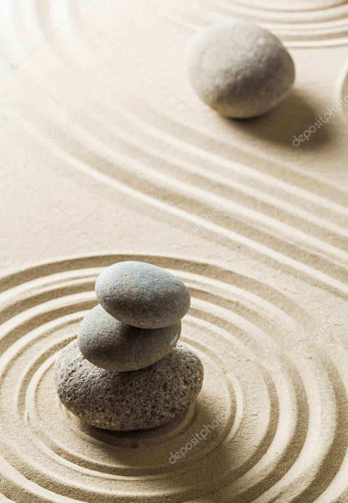 Japanese garden zen stones on sand