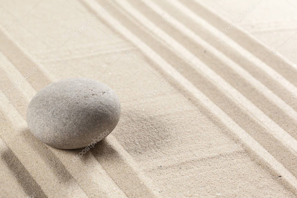 Japanese garden zen stone on sand