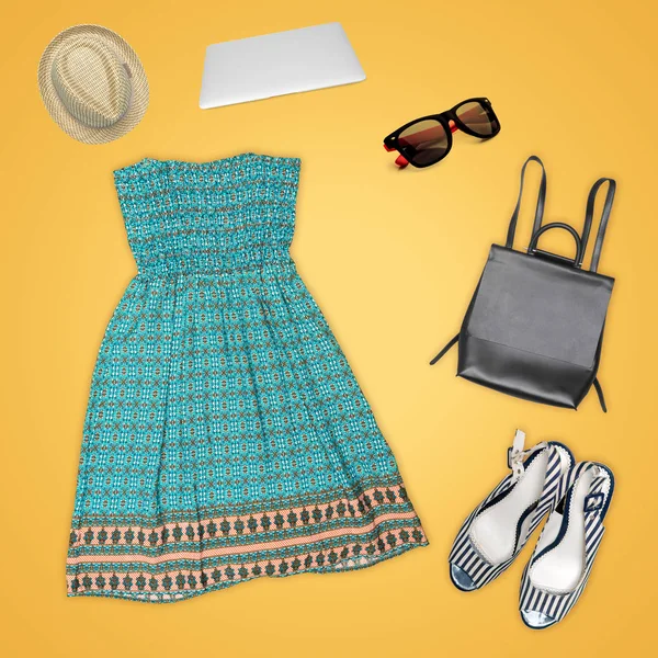 clothes and woman accessories on yellow background