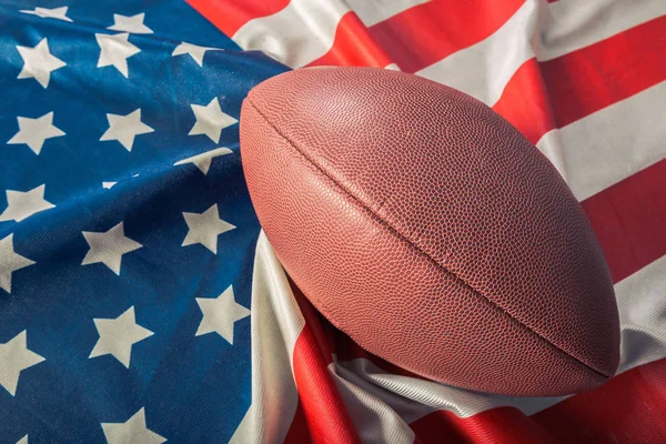 American football on American old glory flag