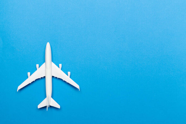 model of passenger plane on blue background